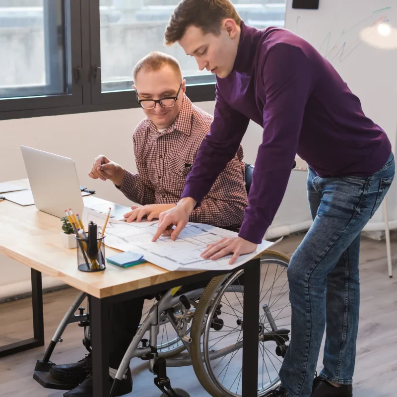 manager-working-together-with-disabled-man